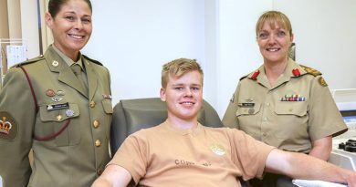 Army Blood Ambassador, Warrant Officer Class Two Geneen Lord and Brigadier Leigh Wilton provide encouragement to Officer Cadet Don Considine as he donates plasma during the Defence Blood Challenge, in Canberra on 1 September 2017. Photo by Corporal Bill Solomou.