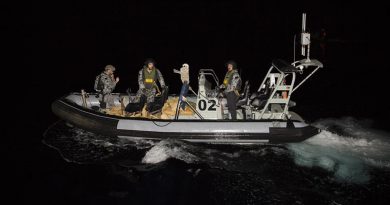 Leading Seaman Caleb Larnach, Able Seaman Eric Schneider and RNZN Leading Seaman Te Orangapumau Elia return to HMAS Warramunga carrying a load of seized narcotics. Photos by Leading Seaman Tom Gibson.