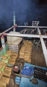 Parcels of seized narcotics lay on the deck of a smuggling vessel as HMAS Warramunga’s boarding team conduct an illicit cargo seizure. Photo by Leading Seaman Tom Gibson.