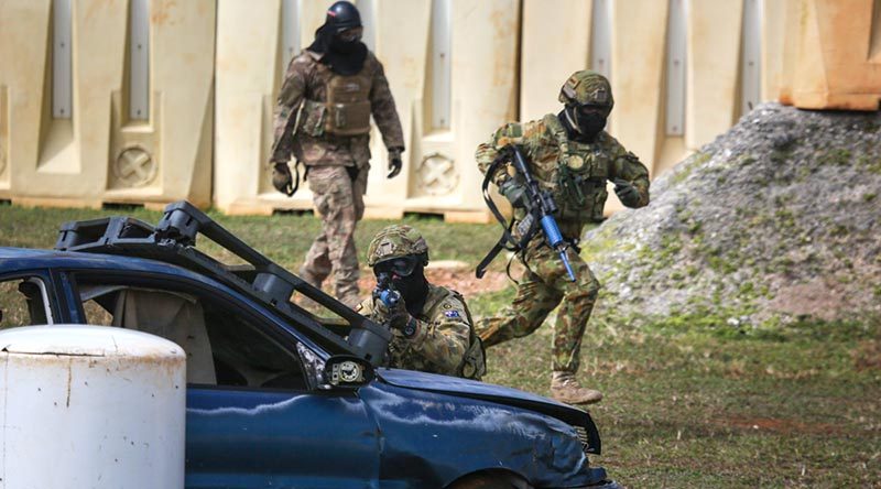 Personnel from No. 2 Security Forces Squadron, USAF and the Japanese Self Defence Force cross train in security tactics for Exercise Cope North 2018, Andersen Air Force Base Guam. Photo by Corporal Glen McCarthy.