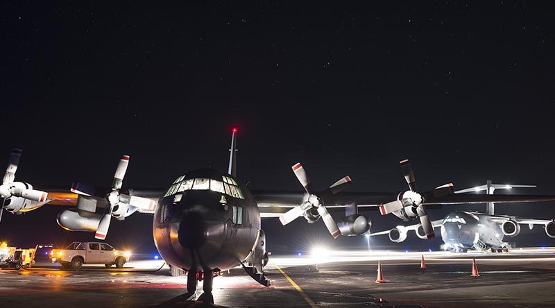 A Royal New Zealand Air Force C-130 Hercules in front of a Royal Australian Air Force C-17 Globemaster at Fuaamotu International Airport, Tonga. NZDF photo.