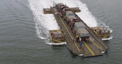 One of four new Improved Ribbon Bridges and four upgraded Bridge Erection Propulsion Boats, to be delivered as part of Project Land 155, undergo 96 tonne load testing with members from the School of Military Engineering on the Georges river. Photo by Belinda Dinami