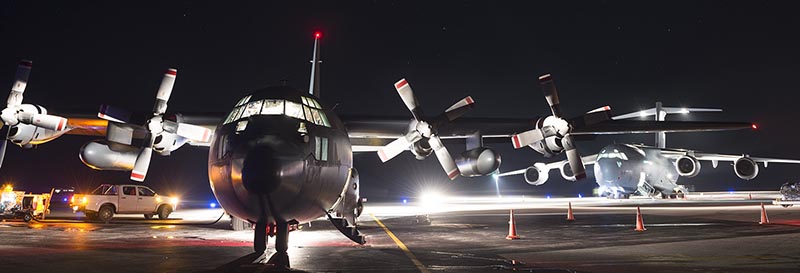 A Royal New Zealand Air Force C-130 Hercules in front of a Royal Australian Air Force C-17 Globemaster at Fuaamotu International Airport, Tonga. Both aircraft were delivering aid to Tonga (13 Feb 2018) on behalf of their respective countries in the wake of Cyclone Gita. NZDF photo.