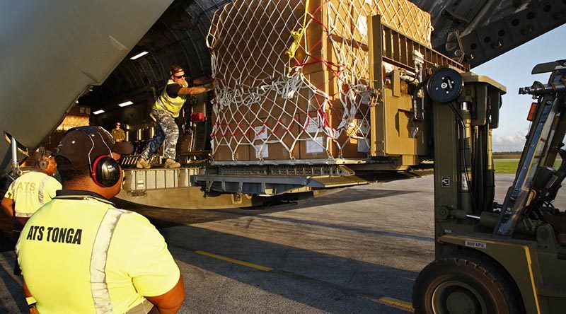 A pallet load of emergency supplies is unloaded from a RAAF C-17A Globemaster in Tonga in the wake of Tropical Cyclone Gita. Photo by Corporal Colin Dadd.