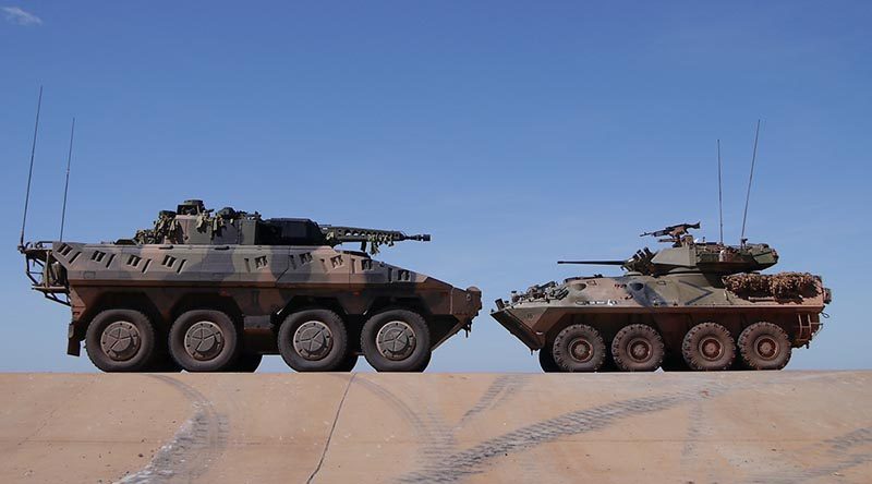 Rheinmetall Boxer CRV with an in-service Australian Light Armoured Vehicle (ASLAV).