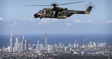 An Australian Army MRH-90 helicopter takes Queensland Police Service Special Emergency Response Team members over the Gold Coast during familiarisation training for the 2018 Commonwealth Games. Photo by Sergeant W Guthrie.