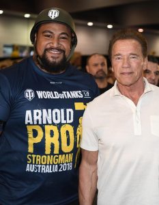 Australia’s strongest man Eddie Williams with Arnold Schwarzenegger at the ‘World of Tanks PC Tank Pull’ at the Arnold Pro Strongman Australia in Melbourne. Photo by Nathan Hopkins.