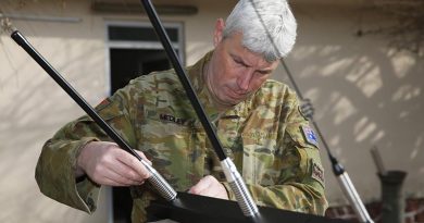 Australian Army officer Lieutenant Colonel Jason Medley prepares to install a Slivershield electronic force protection system, designed for the Afghan National Defence and Security Forces to counter radio-controlled improvised explosive devices. Photo by Sergeant Max Bree.