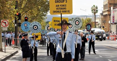 Leading Cadet Liam Mickan, No 613 Squadron, AAFC, carries the Banner at the head of the Air Force veterans of World War 2 for the Anzac Day march in Adelaide. He wore on his right breast the Zimbabwe Independence Medal awarded to his grandfather. Photo by Flying Officer (AAFC) Paul Rosenzweig.