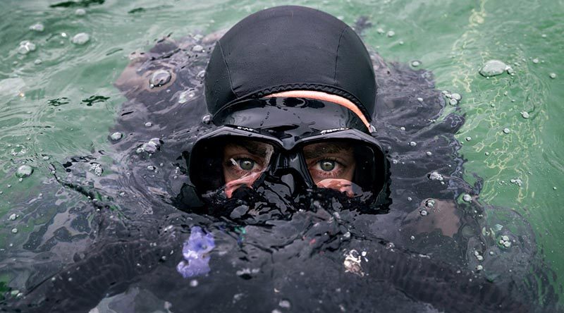 Royal Australian Navy clearance diver Able Seaman Humphrey Macleod submerges during a training activity in support of Queensland Police for the 2018 Gold Coast Commonwealth Games. Photo by Corporal Kyle Genner.