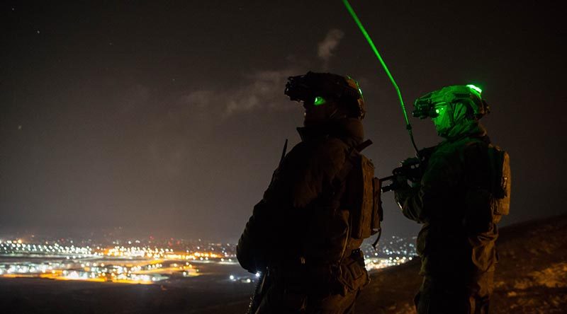 Australian Army Guardian Angels provide security for British mentors at the Afghan National Army Officer Academy during a night-ambush training activity. Photo by Warrant Officer Class 2 Neil Ruskin.