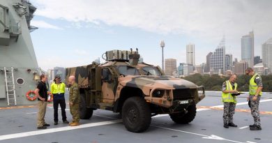 A Hawkei Protected Mobility Vehicle – Light on the flight deck of the Royal Australian Navy amphibious ship HMAS Adelaide during trials at Fleet Base East in Sydney. Photo by Leading Seaman Nicolas Gonzalez.