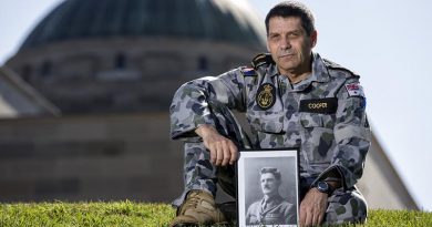 Royal Australian Navy Able Seaman Norman Cooper with a picture of his ancestor, Henry William 'Harry' Murray, VC, CMG, DSO and Bar, DCM, at the Australian War Memorial before going to Gallipoli for ANZAC Day 2018. Photo by Leading Seaman Jake Badior.