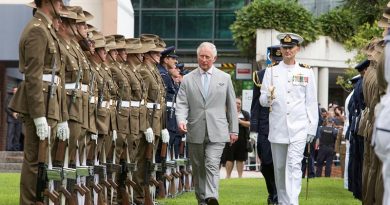 His Royal Highness Prince Charles walks with Commander of Australia’s Federation Guard Lieutenant Commander Shannon Martin to inspect the Royal Guard at Old Government House, Brisbane. Photo by Leading Seaman Nadav Harel.