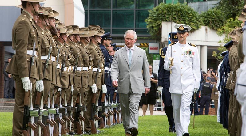 His Royal Highness Prince Charles walks with Commander of Australia’s Federation Guard Lieutenant Commander Shannon Martin to inspect the Royal Guard at Old Government House, Brisbane. Photo by Leading Seaman Nadav Harel.