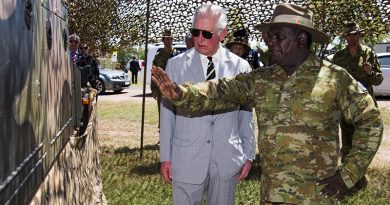 HRH Prince Charles listens to Private Renford Manmurulu explain the use and capability of the regional force surveillance vehicle during the Prince's visit to Larrakeyah. Photo by Leading Seaman James Whittle.