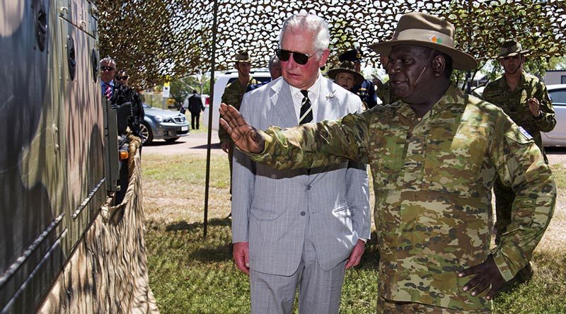 HRH Prince Charles listens to Private Renford Manmurulu explain the use and capability of the regional force surveillance vehicle during the Prince's visit to Larrakeyah. Photo by Leading Seaman James Whittle.