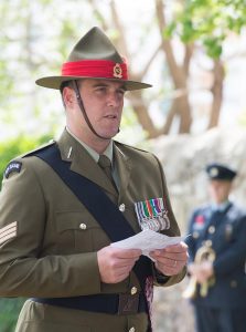 Sergeant Rory Lorimer delivers a reading at the service.