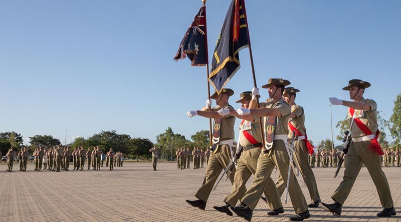 Soldiers from 1st Battalion, Royal Australian Regiment, parade the battalion Colours during Vietnam Week commemorations at Lavarack Barracks, Townsville (2016). Photo by Corporal Kyle Genner.