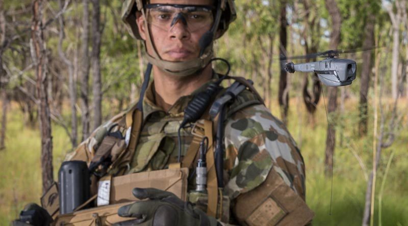 Australian Army Trooper Sam Menzies deploys a PD-100 Black Hornet nano unmanned aircraft during an exercise at Shoalwater Bay. Photo by Nunu Campos.