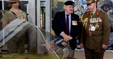 Bill Thurley shows Governor General of Australia General (Retd) Sir Peter Cosgrove a new diorama of the Battle of FSB Coral following a 50th anniversary parade at 1RAR. Photo by Major Al Green.