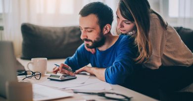 Couple sitting in their living room checking their finances. File photo supplied by Easifleet.