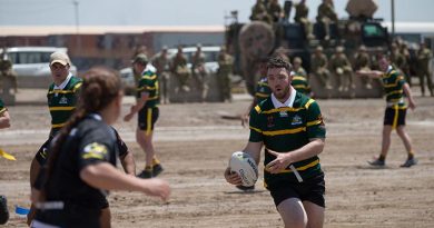 Australian and New Zealand members of Task Group Taji-6 compete in a game of modified rugby league to help raise money for charity on Anzac Day in Iraq.