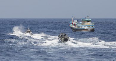 HMAS Warramunga crewmembers prepare to board a vessel suspected of carrying drugs. Photo by Leading Seaman Tom Gibson.