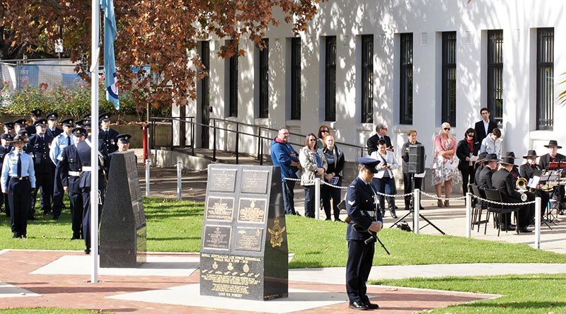The Ensign Orderly from No 6 Wing, AAFC in position in front of the contingent from No 462 Squadron, RAAF, at a Bomber Command Commemoration Service at Torrens Parade Ground in Adelaide. Photo by Flying Officer (AAFC) Paul Rosenzweig.