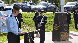 CCPL Nicholas Baylis (613 Squadron, AAFC) gives the Reading. LCDT Jade Curwood, also from No 613 Squadron, was the AAFC Guard Commander. Photo by Flying Officer (AAFC) Paul Rosenzweig.