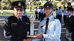 CCPL Nicholas Sibly accepts the Fieldcraft and Teamwork Competition from the OC 6 Wing on behalf of 601 Squadron.