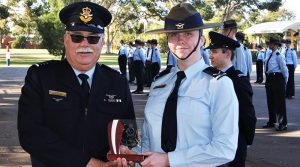 LCDT Caitlyn Edmunds (601 Squadron) receives the trophy for the F-88 (WTSS) Champion Shot.