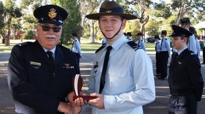 LCDT Jacob Lavery (622 Squadron) receives the trophy for the Wing .22” LR Champion Shot.