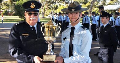 Cadet Corporal Nicholas Sibly accepts the Wing Inter-Squadron Drill Competition trophy on behalf of No 601 Squadron. Photo by Flying Officer (AAFC) Paul Rosenzweig