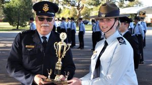 Cadet Flight Sergeant Casey Dibben accepts the Wing Freestyle Drill Competition trophy on behalf of No 608 (Town of Gawler) Squadron.
