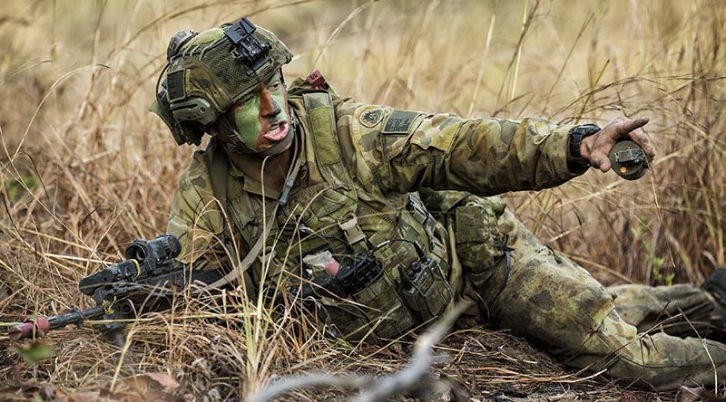 Private Alex Smith of the 6th Battalion, Royal Australian Regiment, shouts a target indication during an assault at Shoalwater Bay Training Area as part of Exercise Hamel 2018. Photo by Leading Seaman Jake Badior.
