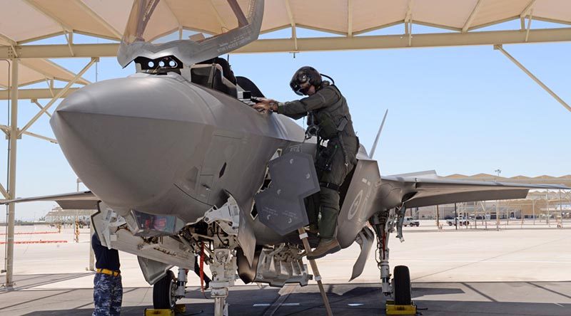 Wing Commander Darren Clare climbs out of aircraft AU 2 after conducting a training mission where his wingman Squadron Leader David Bell flew the 1000th sortie in a Royal Australian Air Force F-35A. USAF photo.