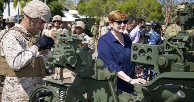 Minister for Defence Marise Payne looks over a M777 howitzer in company with an artillery marine from Marine Rotation Force - Darwin, during a visit to Robertson Barracks, Darwin. Photo by Leading Seaman James Whittle.