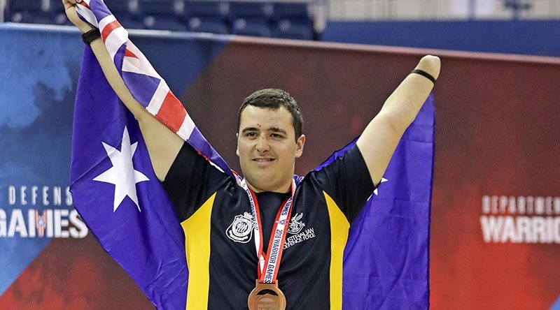 Royal Australian Air Force Pilot Officer Nathan Parker celebrates his bronze-medal performance in indoor rowing at the Warrior Games 2018 at the United States Air Force Academy, Colorado Springs in the USA. Photo by Leading Seaman Jason Tufrey.