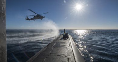 HMAS Ballarat's MH-60R Seahawk conducts a forward passenger transfer with HMAS Rankin in Western Australia, before the submarine departs for RIMPAC18. Photo by Able Seaman Grahame Kelaher.