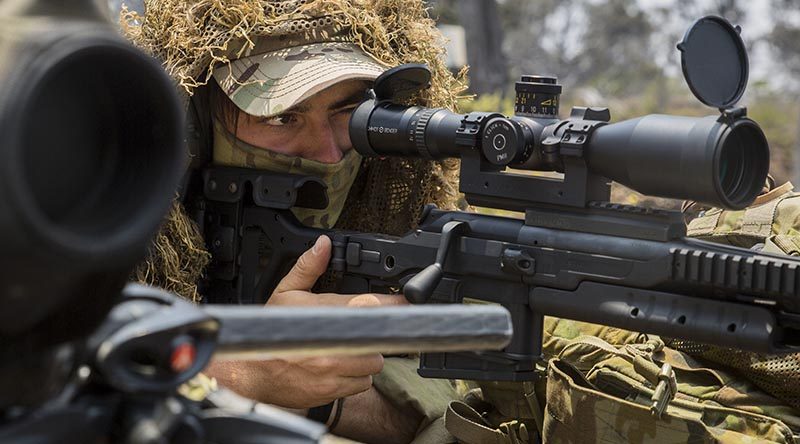 An Australian Army sniper with 2RAR (Amphib) sights in on a target with a Blaser Tactical 2 sniper rifle during live-fire training as part RIMPAC at Pohakuloa Training Area, Hawaii. US Marine Corps photo by Lance Corporal Adam Montera.
