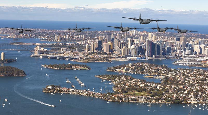 A formation of C-130J Hercules fly over Sydney Harbour to mark the 75th Anniversary of No. 37 Squadron. Photo by Corporal David Gibbs.