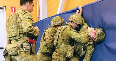 Under the watchful eye of an instructor, soldiers from the 1st Brigade practise subduing an enemy soldier during an Army Combatives Program training session at RAAF Edinburgh. 7RAR photo.