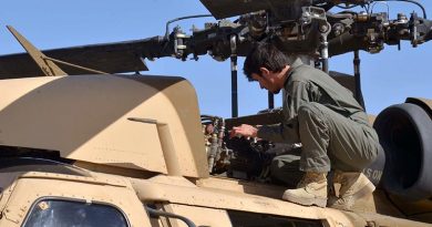 An Afghan Air Force member inspects a UH-60 Black Hawk at Kandahar Air Field, Afghanistan, as air crews prepare for their first Afghan-led operational mission on this aircraft type. US Air Force photo by 1st Lieutenant Erin Recanzone.