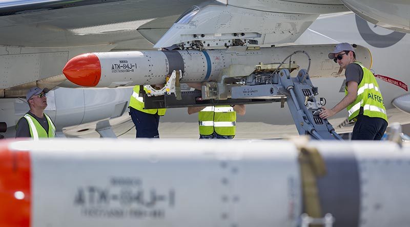 RAAF personnel load an ATM-84J Harpoon on to the port wing of a P-8A Poseidon in Hawaii during RIMPAC – with a second missile visible in the foreground. Other photos show the same personnel loading a Harpoon onto the starboard-wing pylon – indicating that the aircraft was loaded with two missiles. All Defence reporting of this flight talks about a Harpoon missile in the singular. Photo by Corporal Nicci Freeman.