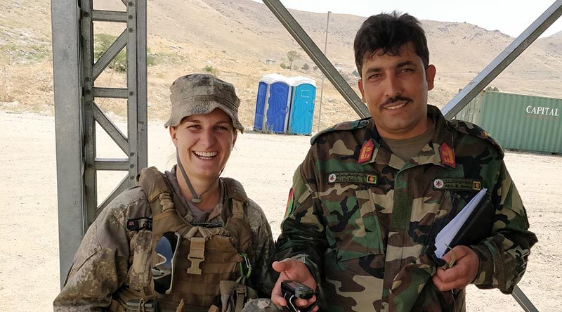 Captain Demi Exley and and un-named Afghan mentee at Camp Qargha, Afghanistan. NZDF photo.