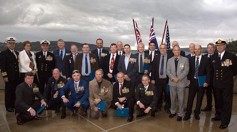 Commander Australian Fleet Rear Admiral Johnathon Mead (right) and US Consul General Linda Daetwyler with Royal Australian Navy's Clearance Diving Team 3 at HMAS Penguin. Photo by Leading Seaman Nicolas Gonzalez.