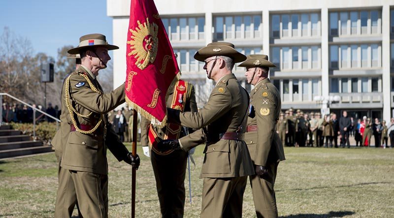 Outgoing Chief of Army Lieutenant General Angus Campbell passes the Army Banner to incoming Chief of Army Lieutenant General Rick Burr during a Chief of Army handover parade at Russell Offices in Canberra. Photo by Grace Costa Banson.