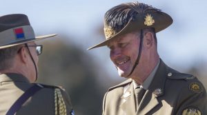 Outgoing Regimental Sergeant Major - Army Warrant Officer Don Spinks, congratulates incoming Chief of Army Lieutenant General Rick Burr during a change-of-command parade in Canberra. Photo by Corporal Tristan Kennedy.