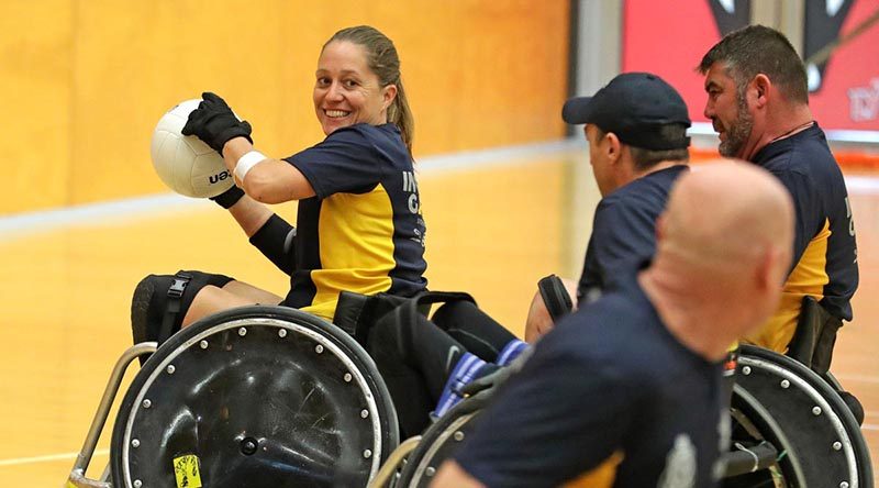 Australian Invictus Games 2018 team member Trudi Lines prepares to pass during a wheelchair rugby exhibition match with RSLWA, in Perth. Photo by Leading Seaman Jason Tufrey